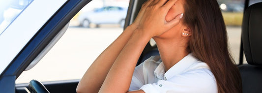 Crying woman in a car